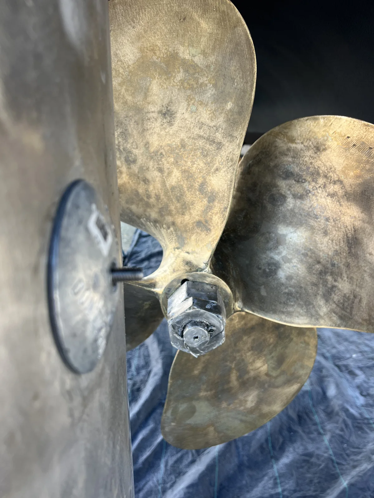 Close inspection view of a marine propeller and shaft anode.